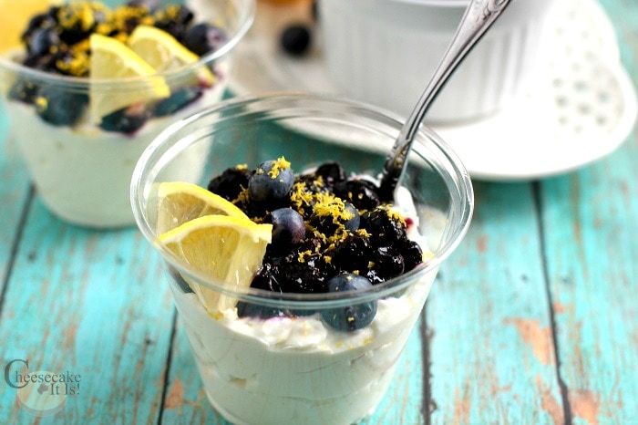 Blueberry Lemon Keto Cheesecake in a cup with a spoon.