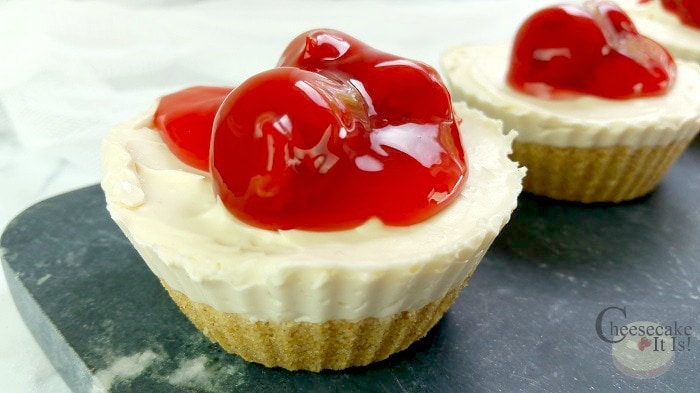 No bake cheesecake cup with cherry topping.