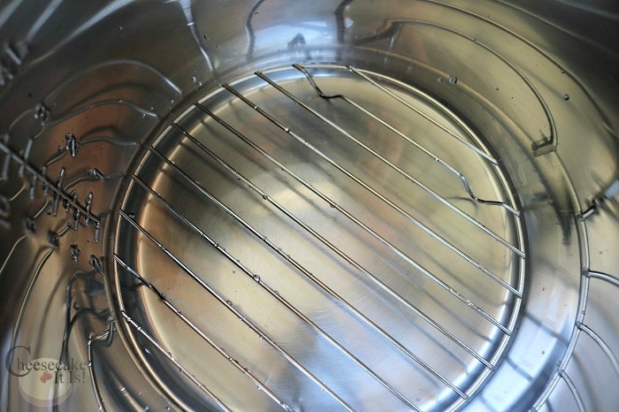 Add water and trivet to inner pot