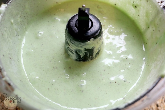 Mint chocolate chip cheesecake batter in mixer