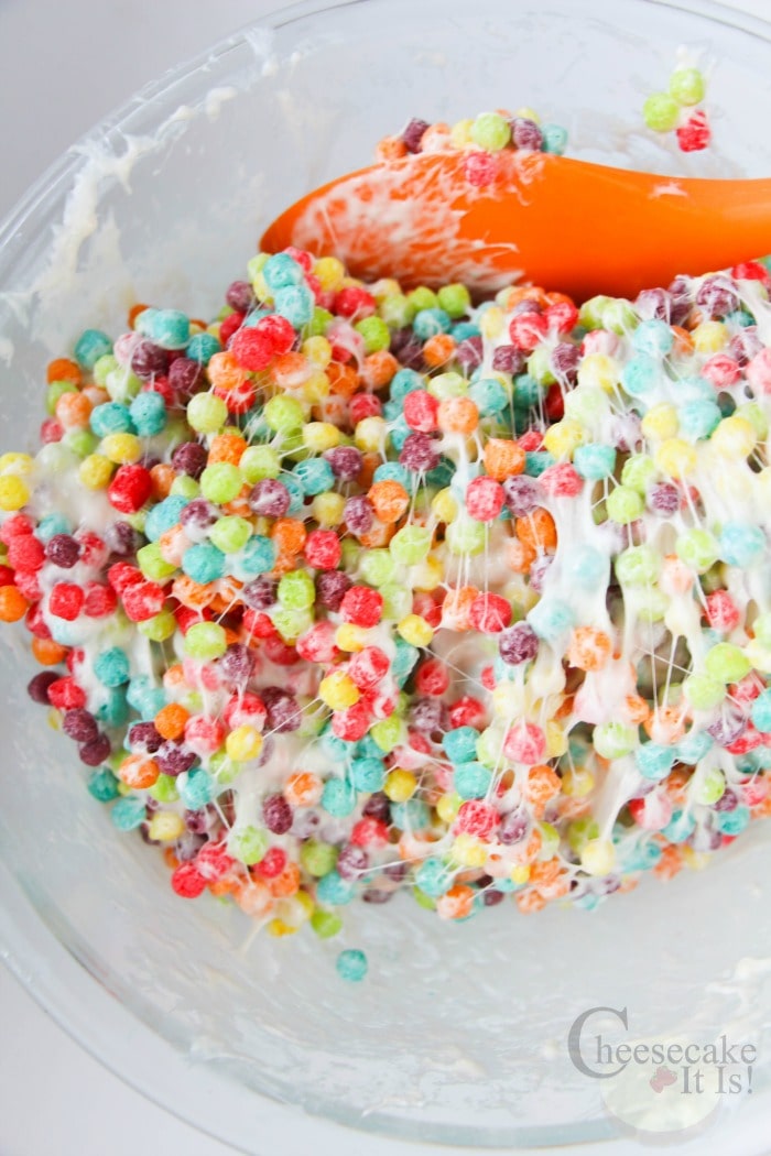 Mix trix with marshmallows in bowl