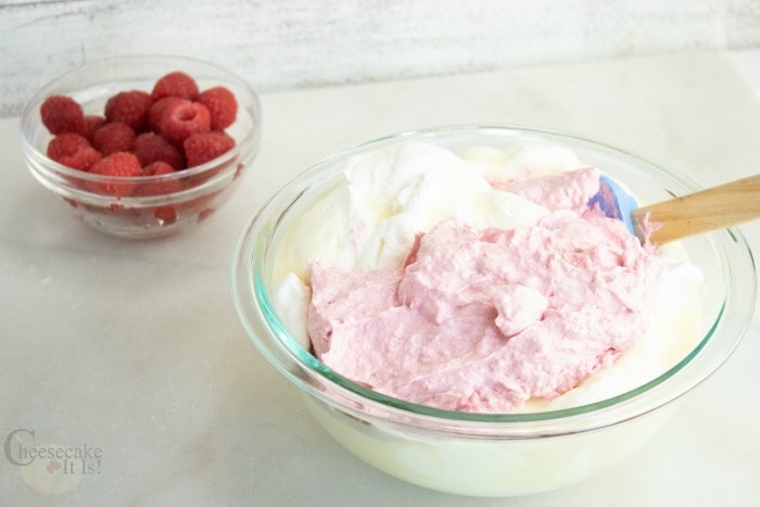 raspberry cheesecake ice cream being mixed