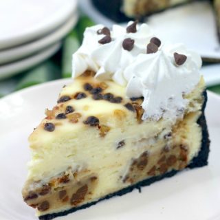 Slice of cookie dough cheesecake on white plate