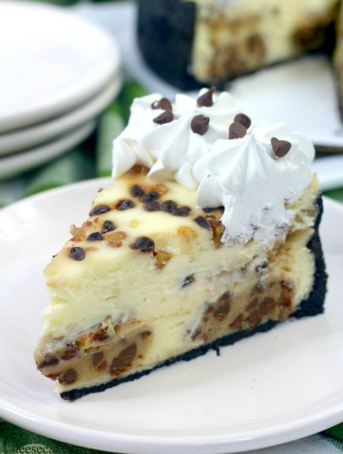 Slice of cookie dough cheesecake on white plate