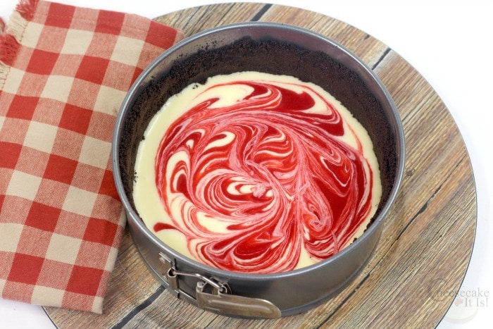 Swirl raspberry and cheesecake together