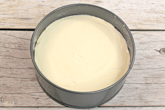 Lemon cheesecake batter in pan