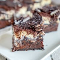 Oreo Cheesecake Brownie Bars on white plate