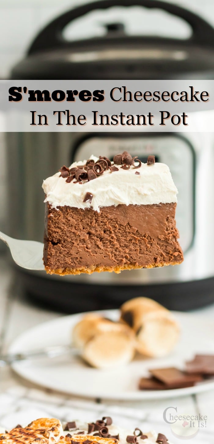 Slice of smores cheesecake being lifted, Instant pot in background. Text overlay that says "S'mores Cheesecake In The Instant Pot"