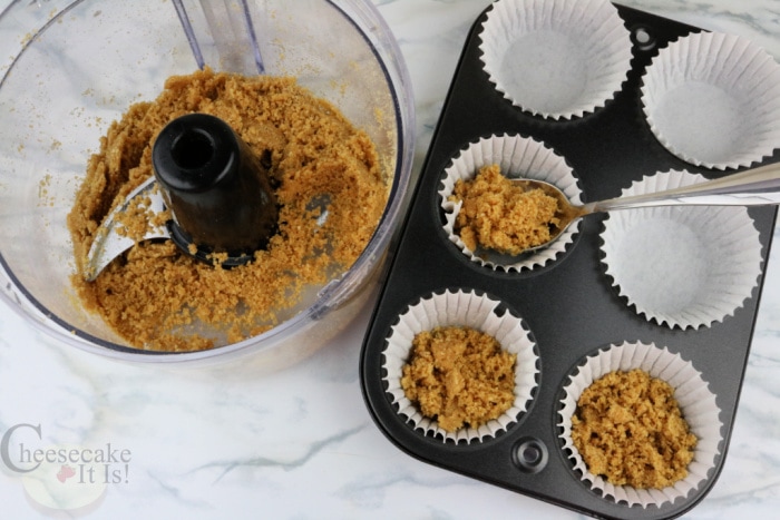 Add crumb mix to muffin liners