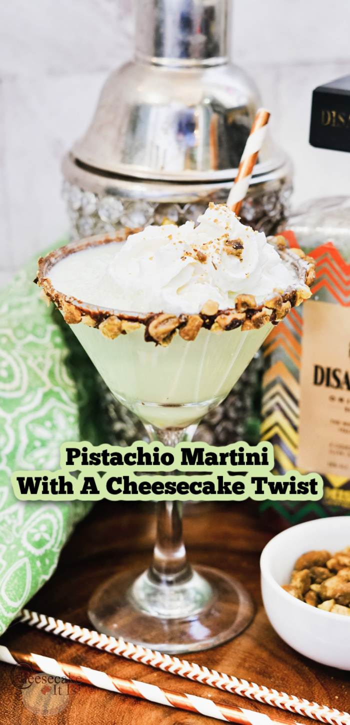 Glass or pistachio martini recipe with shaker and bottle to back and side. Text overlay that says Pistachio Martini With A Cheesecake Twist