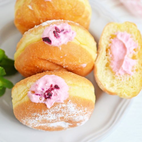 3 brioche donut recipe with raspberry cheesecake filling on white plate