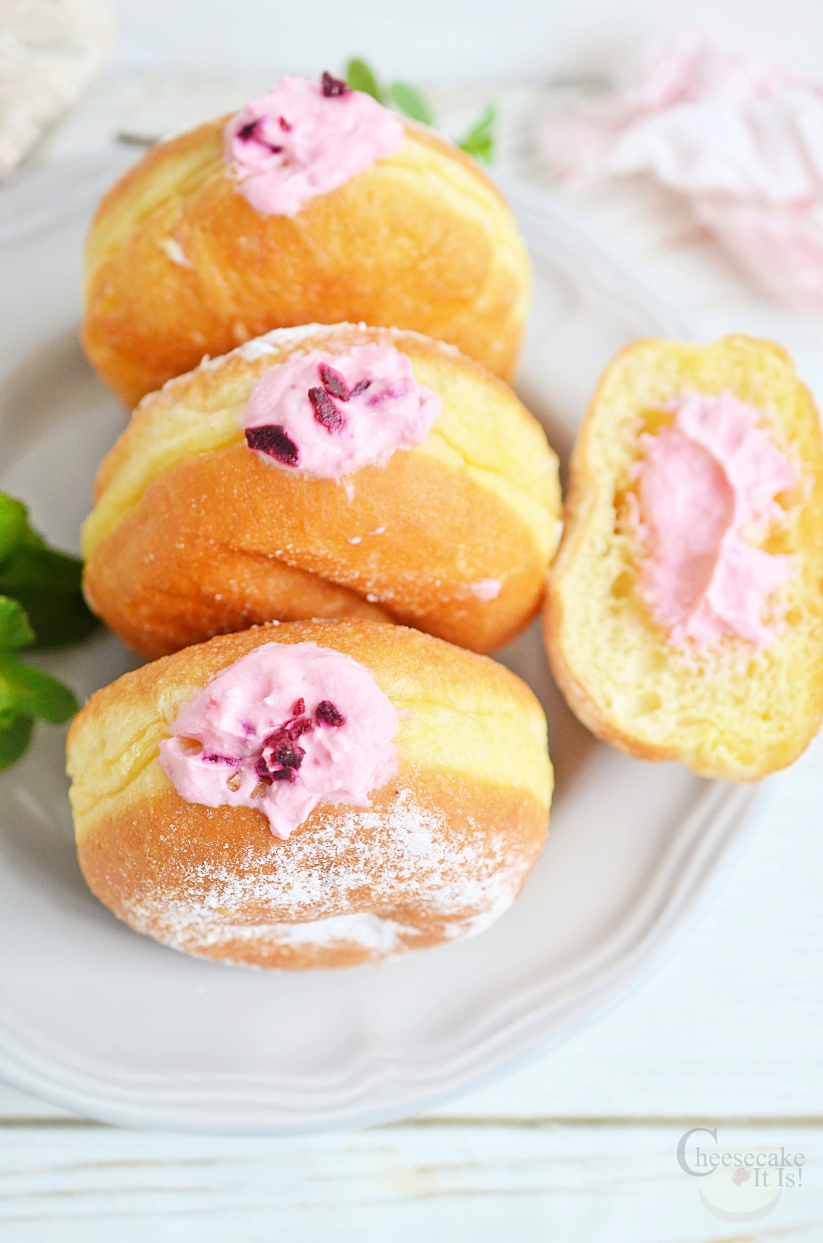 3 brioche donut recipe with raspberry cheesecake filling on white plate