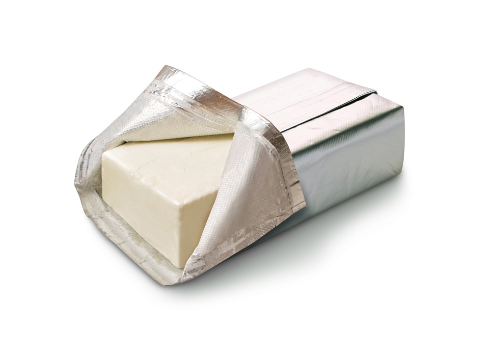 Block of cream cheese in wrapper with one end open